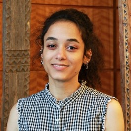 Portrait of a female student with dark hair smiling