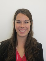 Portrait of an Anglo-American woman with long brown hair smiling